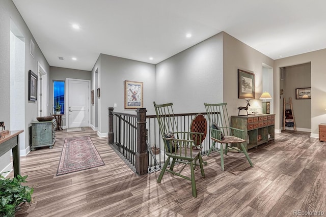 788 Alumroot St, Castle Rock, CO 80104 - corridor with wood finished floors, baseboards, and recessed lighting