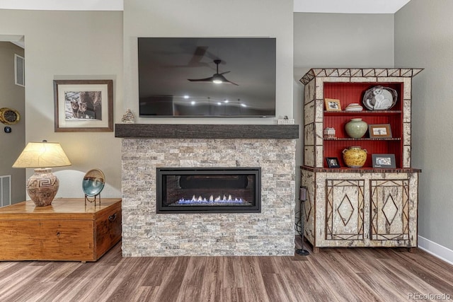 788 Alumroot St, Castle Rock, CO 80104 - living room featuring wood finished floors, a fireplace, ceiling fan, and baseboards