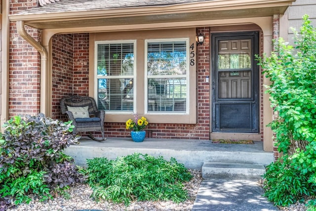 458 Rolling Hills Dr, Colorado Springs, CO 80919 - doorway to property featuring brick siding and a porch