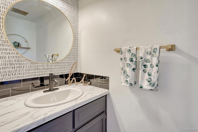 458 Rolling Hills Dr, Colorado Springs, CO 80919 - bathroom with vanity and tasteful backsplash