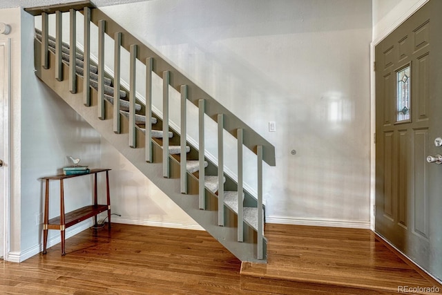 458 Rolling Hills Dr, Colorado Springs, CO 80919 - stairway featuring baseboards and wood finished floors