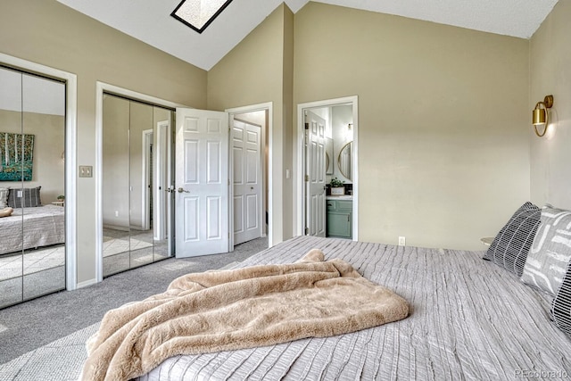 458 Rolling Hills Dr, Colorado Springs, CO 80919 - bedroom featuring two closets, carpet flooring, high vaulted ceiling, and connected bathroom