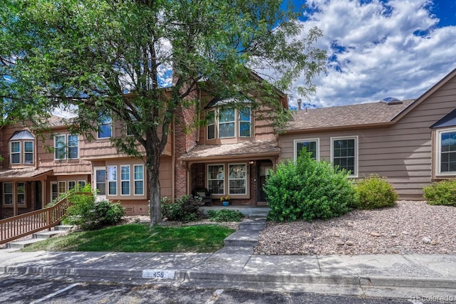 458 Rolling Hills Dr, Colorado Springs, CO 80919 - view of front facade with uncovered parking and a porch