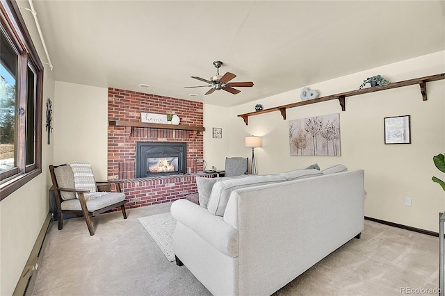 living room with baseboard heating, ceiling fan, a brick fireplace, and light carpet