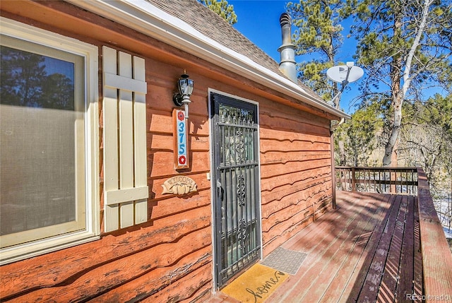 entrance to property with a wooden deck