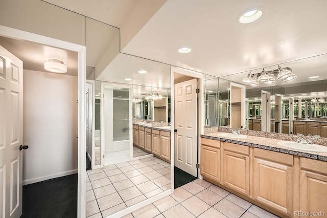 bathroom featuring tile patterned flooring, double vanity, recessed lighting, and a sink