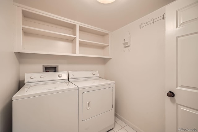 laundry room with laundry area, washer and dryer, and baseboards