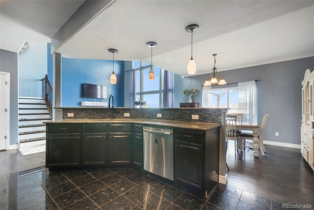 10525 Mt Sherman Way, Peyton, CO 80831 - kitchen featuring dishwasher, a sink, decorative backsplash, baseboards, and pendant lighting