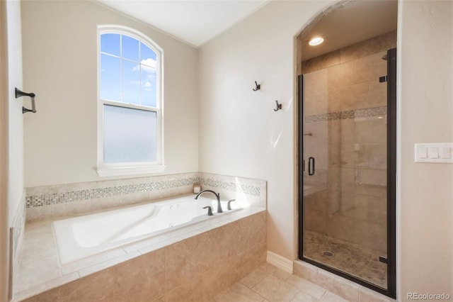 10525 Mt Sherman Way, Peyton, CO 80831 - bathroom with a garden tub, a stall shower, plenty of natural light, and tile patterned flooring