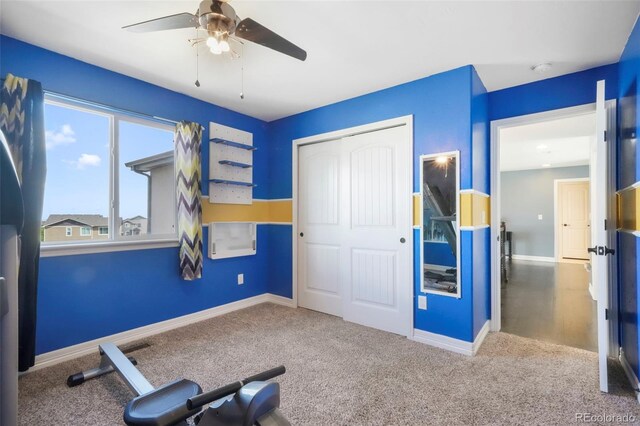 10525 Mt Sherman Way, Peyton, CO 80831 - workout area featuring ceiling fan, carpet floors, and baseboards