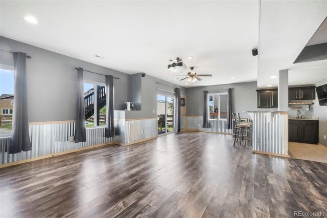 10525 Mt Sherman Way, Peyton, CO 80831 - unfurnished living room featuring wood finished floors, ceiling fan, recessed lighting, and a sink