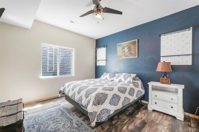 10525 Mt Sherman Way, Peyton, CO 80831 - bedroom featuring wood finished floors, baseboards, and a ceiling fan