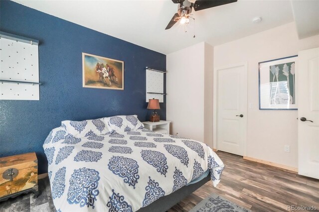 10525 Mt Sherman Way, Peyton, CO 80831 - bedroom with wood finished floors and ceiling fan