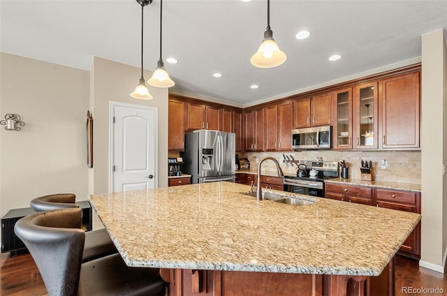 2043 S Cathay Way, Aurora, CO 80013 - kitchen featuring appliances with stainless steel finishes, light stone countertops, dark wood-style flooring, a breakfast bar area, and recessed lighting