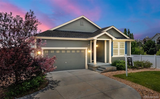 2043 S Cathay Way, Aurora, CO 80013 - view of front of house with an attached garage, concrete driveway, and a shingled roof