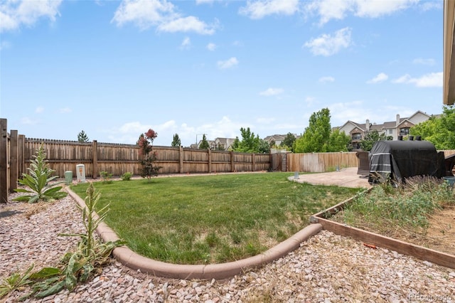 2043 S Cathay Way, Aurora, CO 80013 - fenced backyard with a patio area