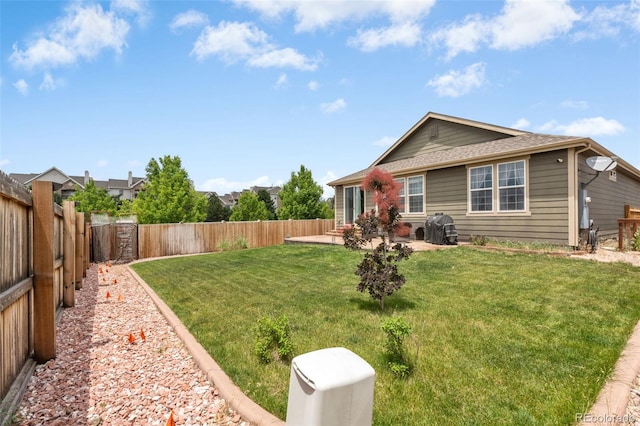 2043 S Cathay Way, Aurora, CO 80013 - rear view of property featuring a fenced backyard and a patio area