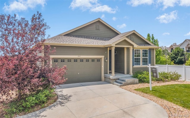2043 S Cathay Way, Aurora, CO 80013 - ranch-style home featuring a garage, driveway, and roof with shingles