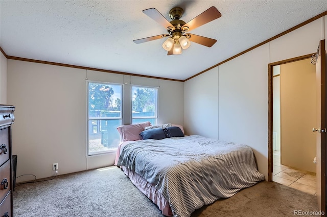 3715 Mcavoy Ave, Evans, CO 80620 - carpeted bedroom with crown molding, vaulted ceiling, a textured ceiling, and a ceiling fan