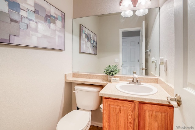 3779 Aspen Hollow Ct, Castle Rock, CO 80104 - bathroom with toilet, vanity, and a textured wall