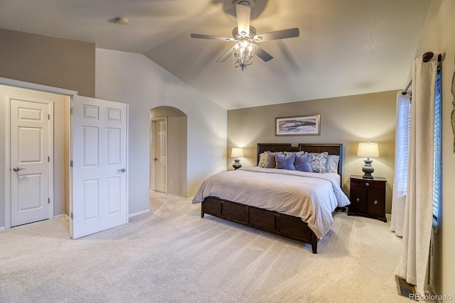 3779 Aspen Hollow Ct, Castle Rock, CO 80104 - bedroom with arched walkways, light carpet, vaulted ceiling, ceiling fan, and baseboards