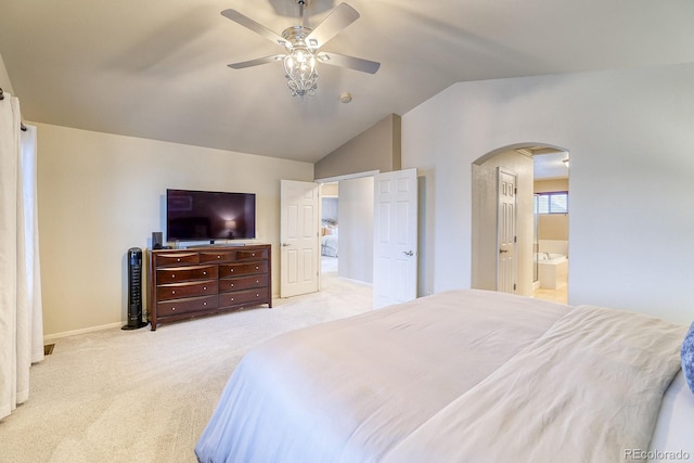 3779 Aspen Hollow Ct, Castle Rock, CO 80104 - bedroom with arched walkways, vaulted ceiling, carpet floors, baseboards, and connected bathroom