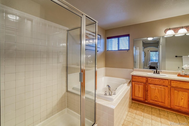 3779 Aspen Hollow Ct, Castle Rock, CO 80104 - full bathroom with ensuite bathroom, a garden tub, a shower stall, and vanity