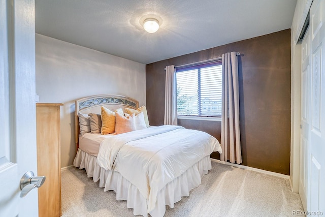3779 Aspen Hollow Ct, Castle Rock, CO 80104 - bedroom featuring light carpet, a closet, and baseboards