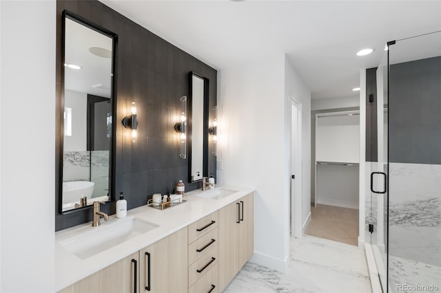 bathroom featuring vanity and a shower with shower door