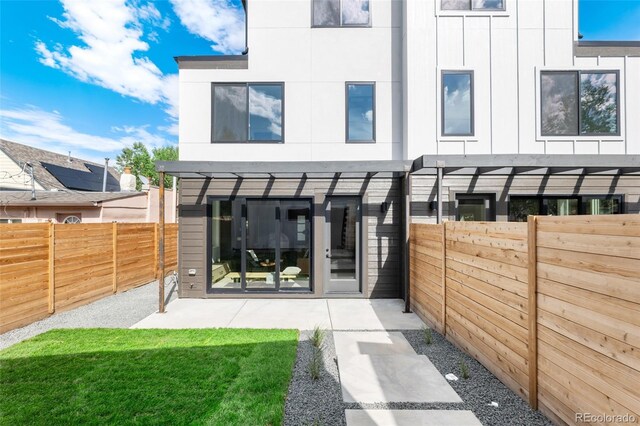 rear view of house with a pergola