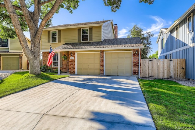 8156 Carr Cir, Arvada, CO 80005 - traditional-style house with brick siding, driveway, and a chimney