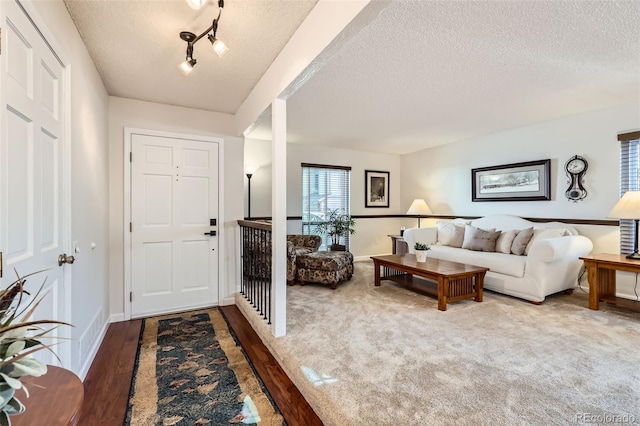8156 Carr Cir, Arvada, CO 80005 - entryway featuring a textured ceiling and wood finished floors