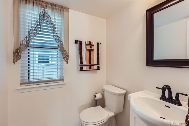 8156 Carr Cir, Arvada, CO 80005 - half bath featuring toilet and vanity