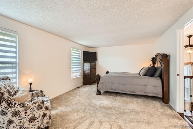8156 Carr Cir, Arvada, CO 80005 - bedroom with light carpet and a textured ceiling