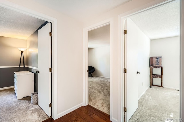 8156 Carr Cir, Arvada, CO 80005 - corridor featuring carpet and a textured ceiling