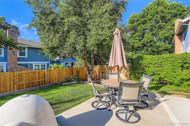 8156 Carr Cir, Arvada, CO 80005 - fenced backyard with a patio and outdoor dining area
