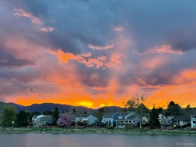 8156 Carr Cir, Arvada, CO 80005 - water view featuring a mountain backdrop and nearby suburban area