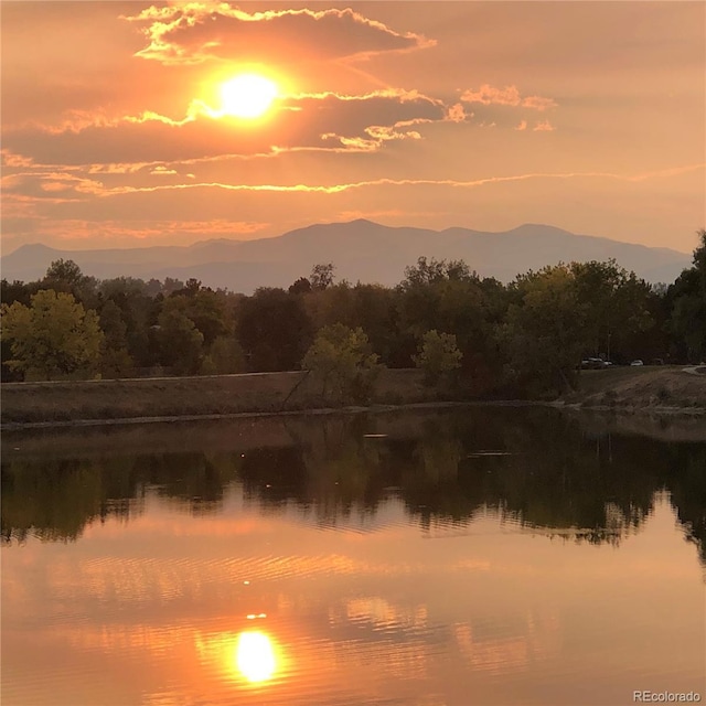 8156 Carr Cir, Arvada, CO 80005 - water view featuring a heavily wooded area and a mountainous background