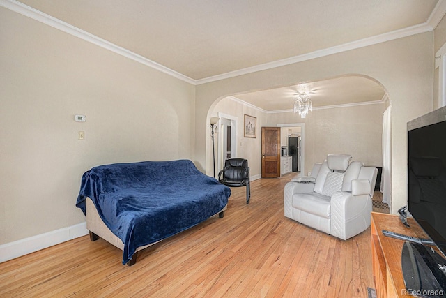 3159 36th Ave, Denver, CO 80211 - bedroom featuring arched walkways, light wood-type flooring, crown molding, baseboards, and a chandelier
