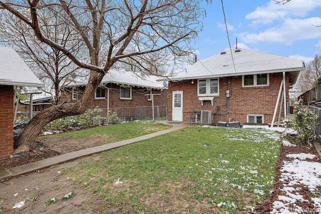 3159 36th Ave, Denver, CO 80211 - rear view of property with brick siding, central AC unit, fence, and a yard