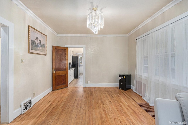 3159 36th Ave, Denver, CO 80211 - interior space with an inviting chandelier, visible vents, ornamental molding, light wood-style floors, and baseboards