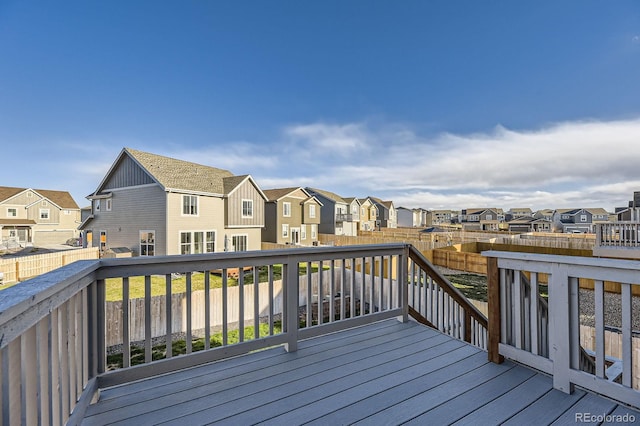 deck featuring a residential view and a fenced backyard