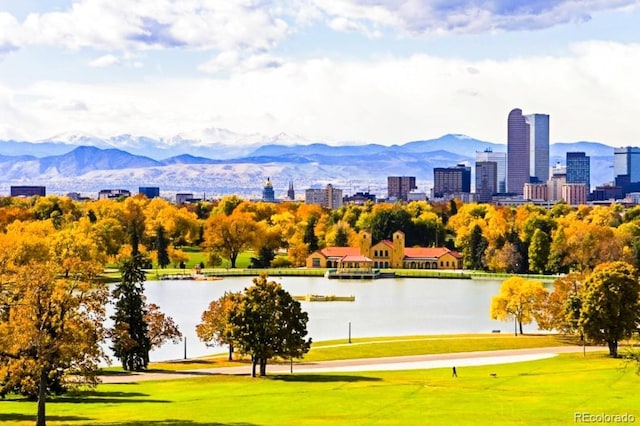 surrounding community with view of golf course, a view of city, and a water and mountain view