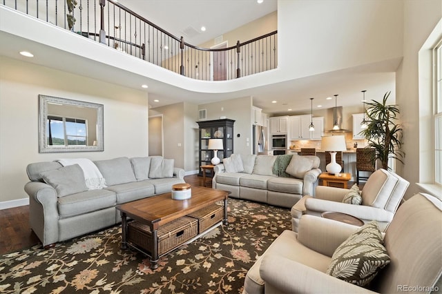 17452 W 83rd Pl, Arvada, CO 80007 - living area with a high ceiling, baseboards, recessed lighting, and wood finished floors