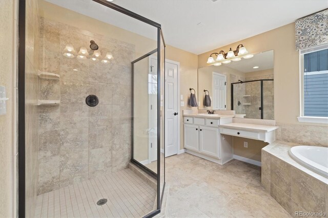 17452 W 83rd Pl, Arvada, CO 80007 - full bathroom with a shower stall, a garden tub, vanity, and tile patterned floors