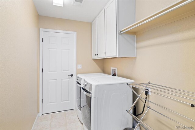 17452 W 83rd Pl, Arvada, CO 80007 - laundry room featuring washing machine and clothes dryer, cabinet space, and baseboards