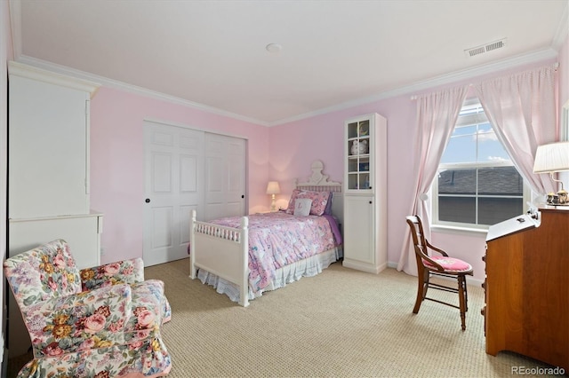 17452 W 83rd Pl, Arvada, CO 80007 - bedroom featuring ornamental molding, light colored carpet, and a closet