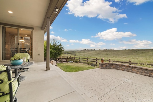 17452 W 83rd Pl, Arvada, CO 80007 - view of patio with fence and a rural view