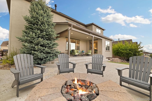 17452 W 83rd Pl, Arvada, CO 80007 - view of patio / terrace featuring a fire pit