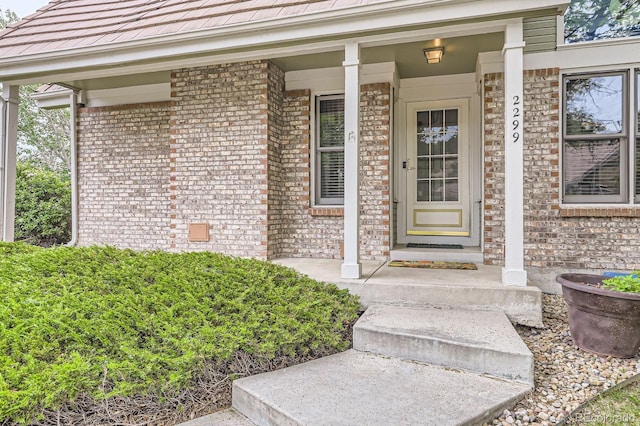 2299 Ranch Dr, Westminster, CO 80234 - property entrance featuring brick siding and covered porch